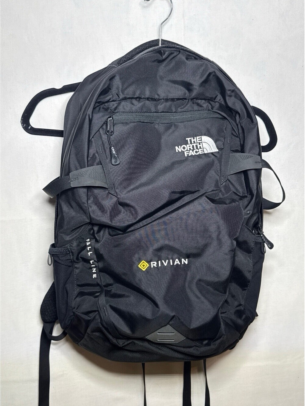 The North Face Fall Line Backpack Rivian Corporate Logo Black With Book